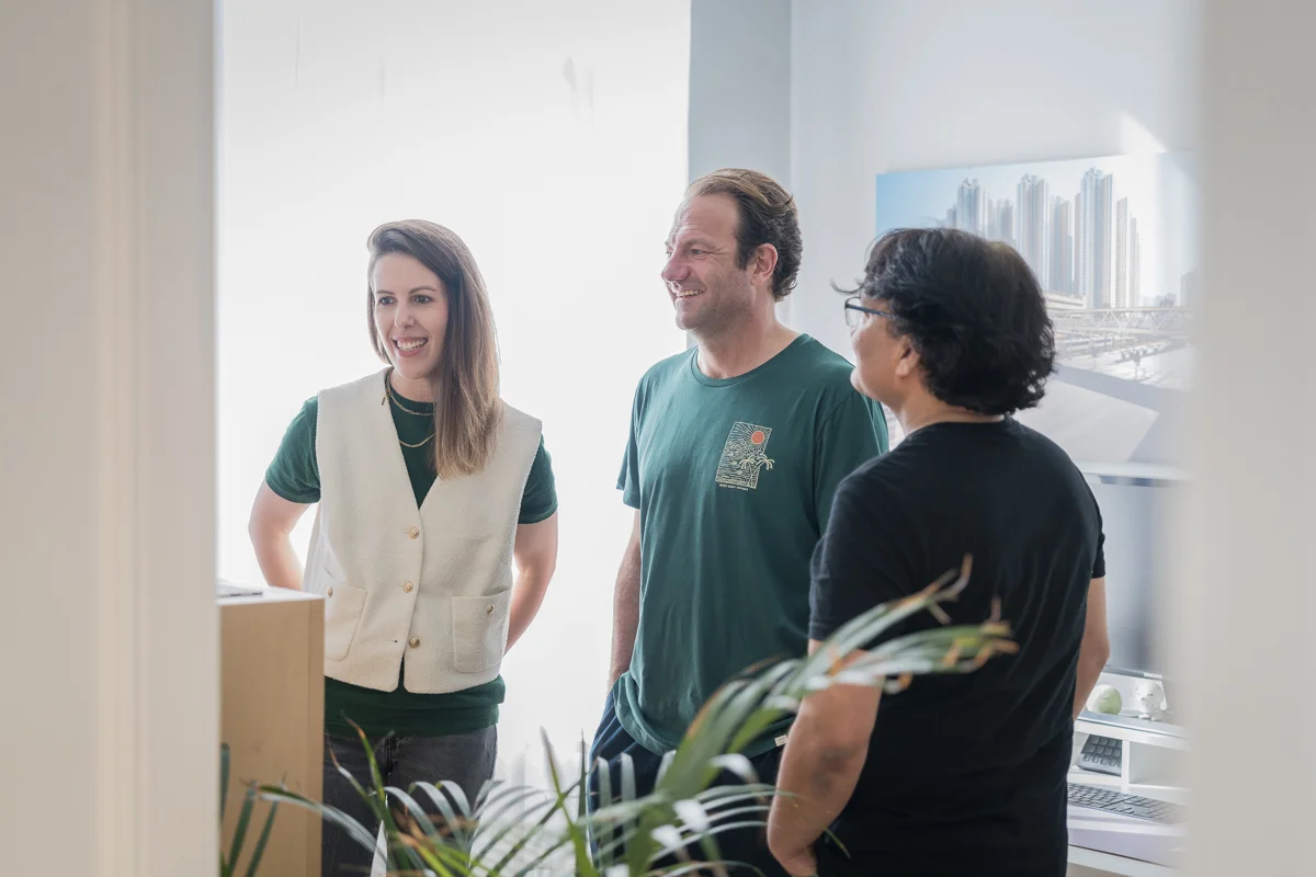 Three colleagues having a casual conversation