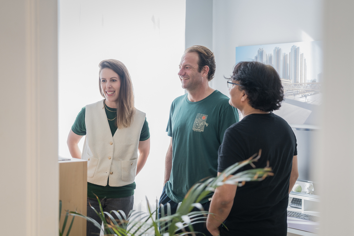 Three colleagues having a casual conversation