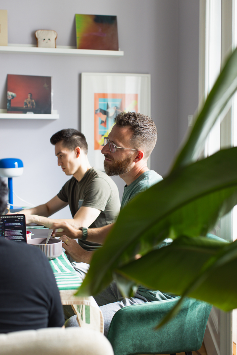 Two team members focused on code side by side