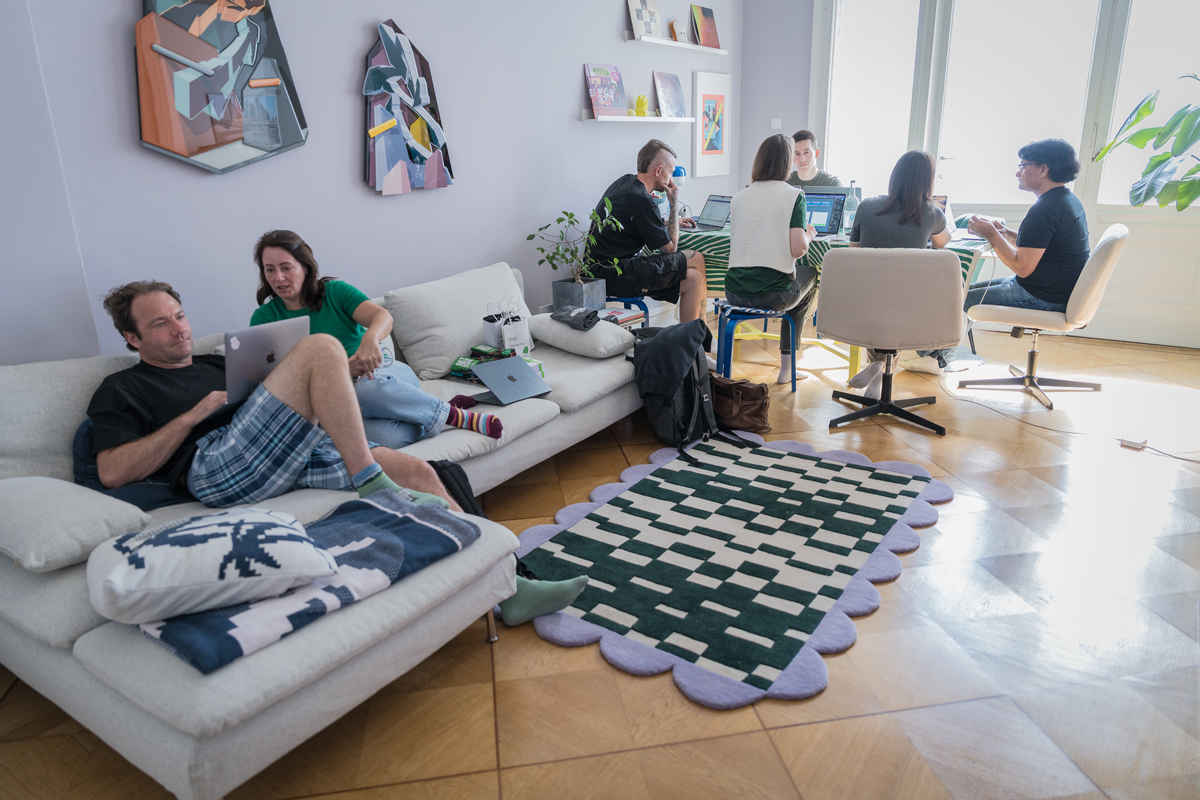Full team working comfortably from couches and chairs